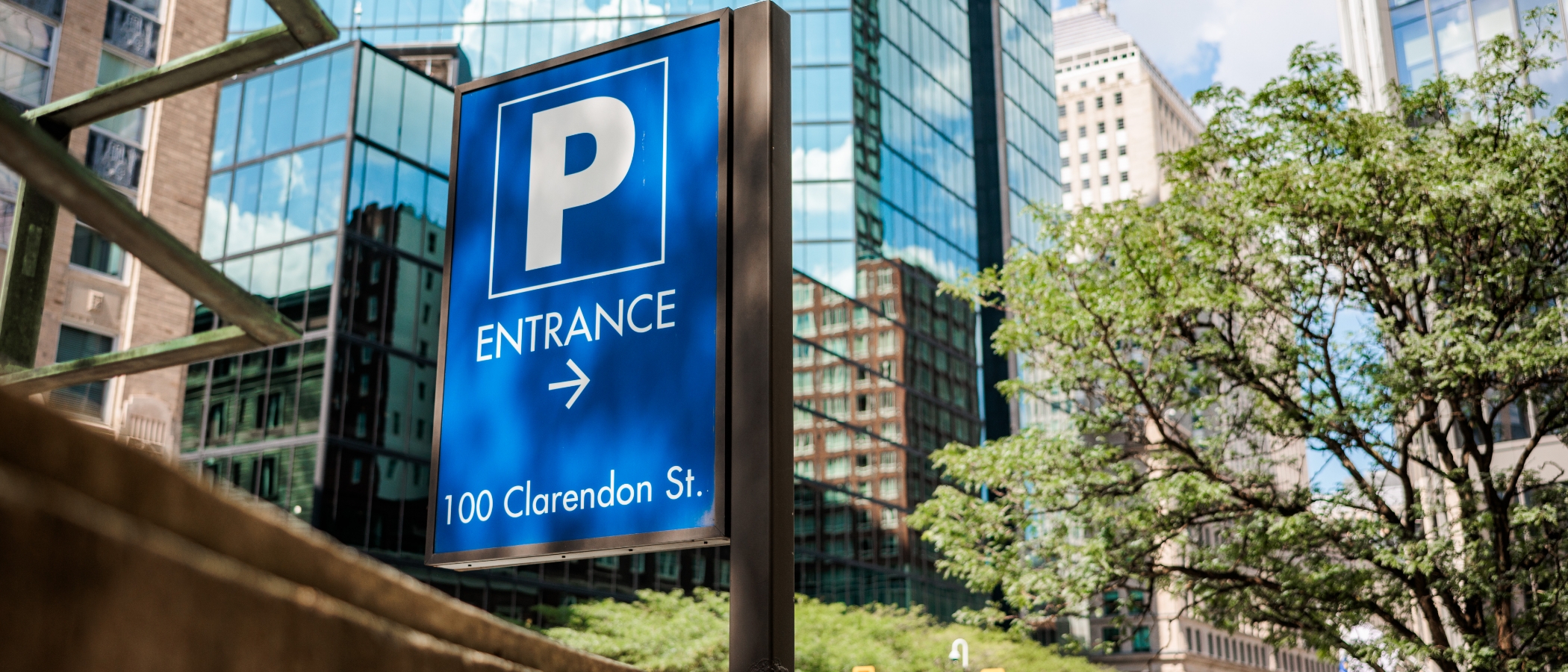 Validated parking at the 100 Clarendon Street garage in Boston Back Bay near Copley Square with clear signage and parked cars